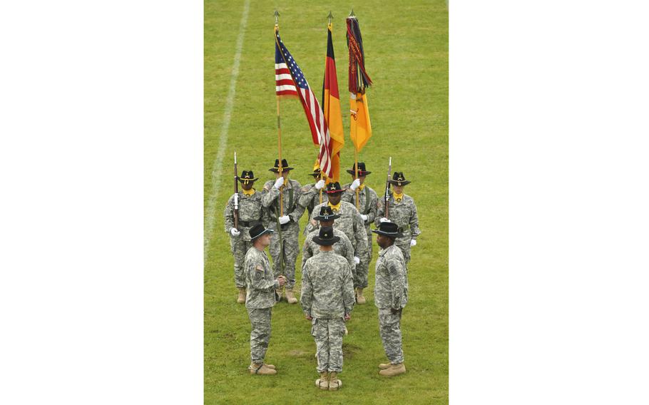 The 2nd Cavalry Regiment displays national flags and the regimental guidon during a change of responsibility ceremony in 2014 at Rose Barracks in Vilseck, Germany. The U.S. and German flags were stolen from the regiment’s headquarters overnight between Oct. 3 and Oct. 4, 2021, Army officials said. A Confederate battle flag was found on a flagpole outside and removed upon discovery, officials said.   