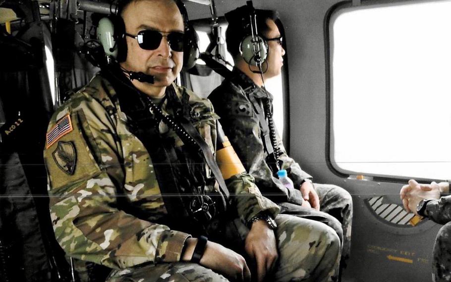 Army Lt. Col. Austin Hamner flies in a helicopter over the Korean Demilitarized Zone in October 2017.