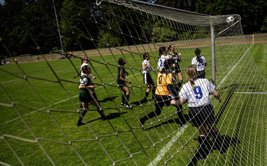 Players from Brussels and AFNORTH crowd the Brussels goal as Maggie Masse scores during the 2024 DODEA European Soccer Division III Championships in Landstuhl, Germany, on May 20, 2024.a