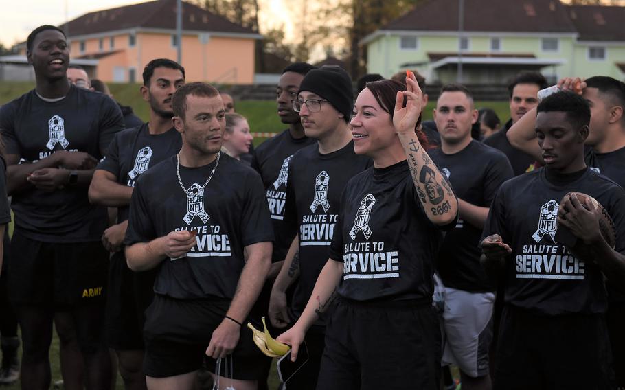 Staff Sgt. Diana Duran holds up one of the winning tickets for Sundays NFL game in Munich, at the NFL Salute to Service boot camp at Vilseck, Germany on Nov. 9, 2022. 