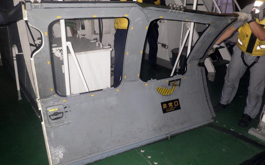 This door from the missing UH-60JA Black Hawk was found in the East China Sea northwest of Miyako Island, Okinawa, Thursday, April 6, 2023.