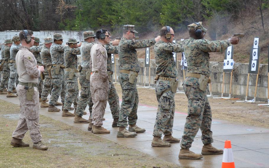 Marines participate in a pistol marksmanship course March 5, 2024, at Marine Corps Base Quantico, Va.