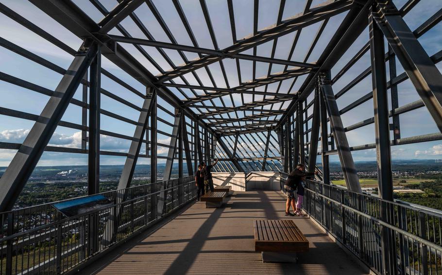 Visitors take in the panorama from the viewing platform of the Saar Polygon on Aug. 27, 2023.The almost 100-foot-high tower serves as a modern memorial to Saarland's coal mining heritage.