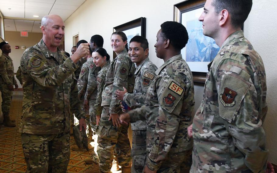 Air Force Col. William Hunter, commander of 81st Training Wing at Keesler Air Force Base in Mississippi, was relieved of command this week. In this photo from Sept. 1, 2022, Hunter congratulates senior airmen at an event at the base.