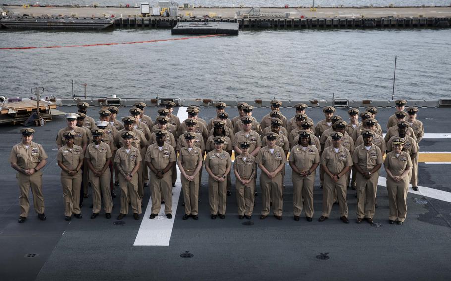 A group of Navy chiefs pose for a photo