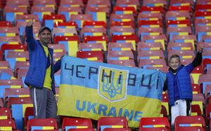 Ukrainian fans cheer prior to the star of the UEFA Nations League soccer match between Scotland and Ukraine, at Hampden Park, in Glasgow, Scotland, Wednesday, Sept. 21, 2022. (AP Photo/Scott Heppell)