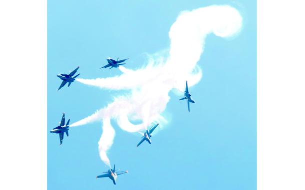Annapolis, MD, May 20, 2015:  The Blue Angels demonstration team performs one of their close-contact maneuvers as part of the U.S. Naval Academy's Commissioning Week festivities. 

META DATA: Naval Acadamy; U.S. Navy; Blue Angels; 