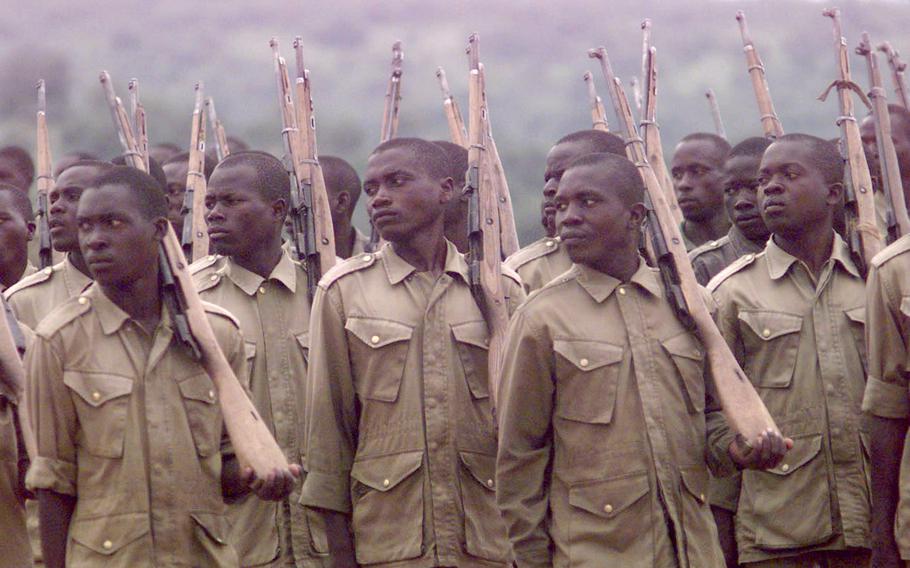 Ugandan soldiers, who are all volunteers, spend nine months in basic training.  These troops, training with wooden rifles, are about to graduate. 