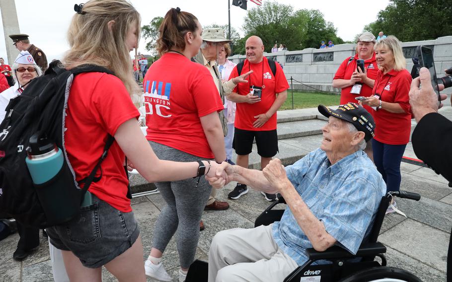 World War II veteran Les Jones greets students from Kenosha, Wis., at the World War II Memorial on the National Mall in Washington, D.C., on Memorial Day, May 29, 2023.