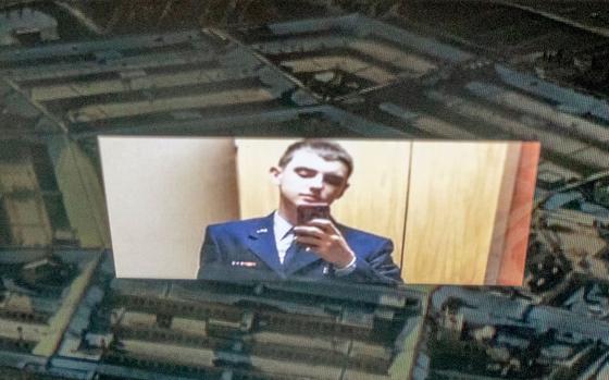 This photo illustration created on Apr. 13, 2023, shows the suspect, National Guardsman Jack Teixeira, reflected in an image of the Pentagon in Washington, D.C. He is suspected of being behind a major leak of sensitive U.S. government secrets. (Stefani Reynolds/AFP via Getty Images/TNS)