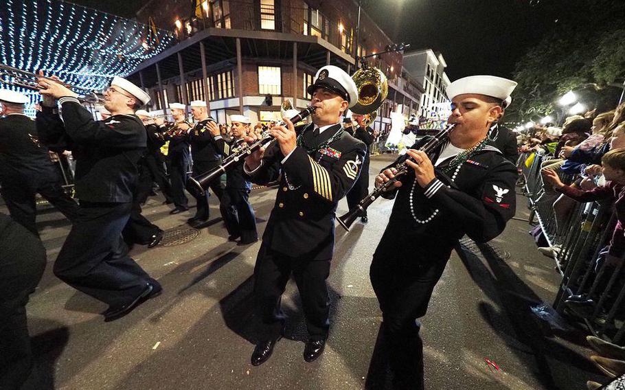 The U.S. Navy Band Southeast performs as Crewe of Columbus rolls during Mardi Gras on Friday, Feb. 25, 2022, in downtown Mobile, Ala. 