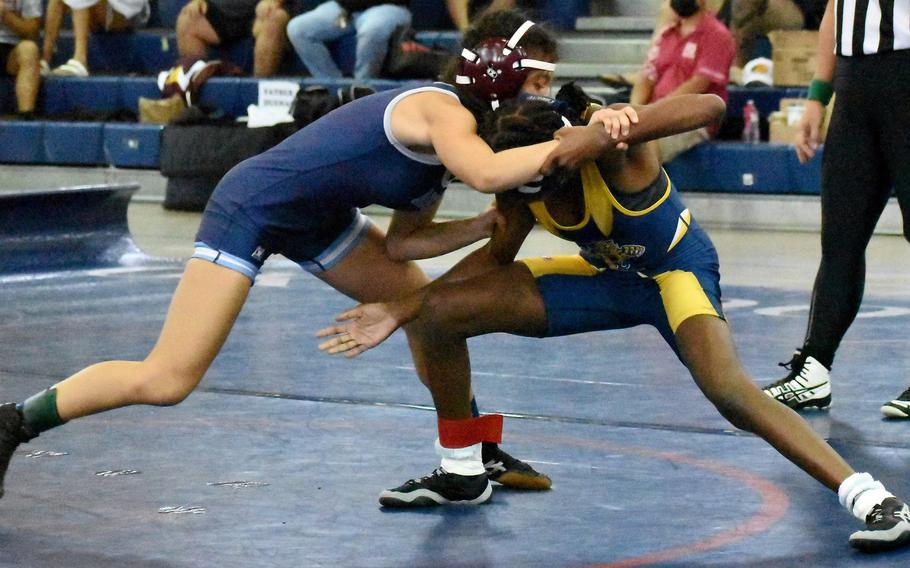 Cirie Hawkins of Guam High tries to gain the edge on Okkodo's Ligaya Imanil during Saturday's Guam wrestling dual meet. Hawkins pinned Imanil in 3 minutes, 48 seconds, and the Panthers won the meet 30-0.