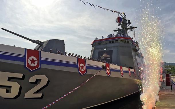 Pyrotechnics go off alongside a North Korean destroyer.