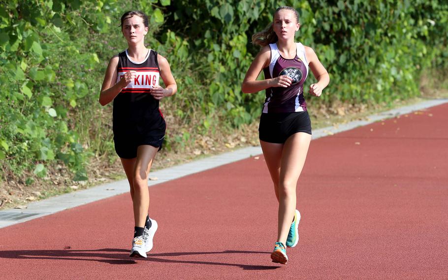 Brightyn Iverson and Hannah Jernigan run.