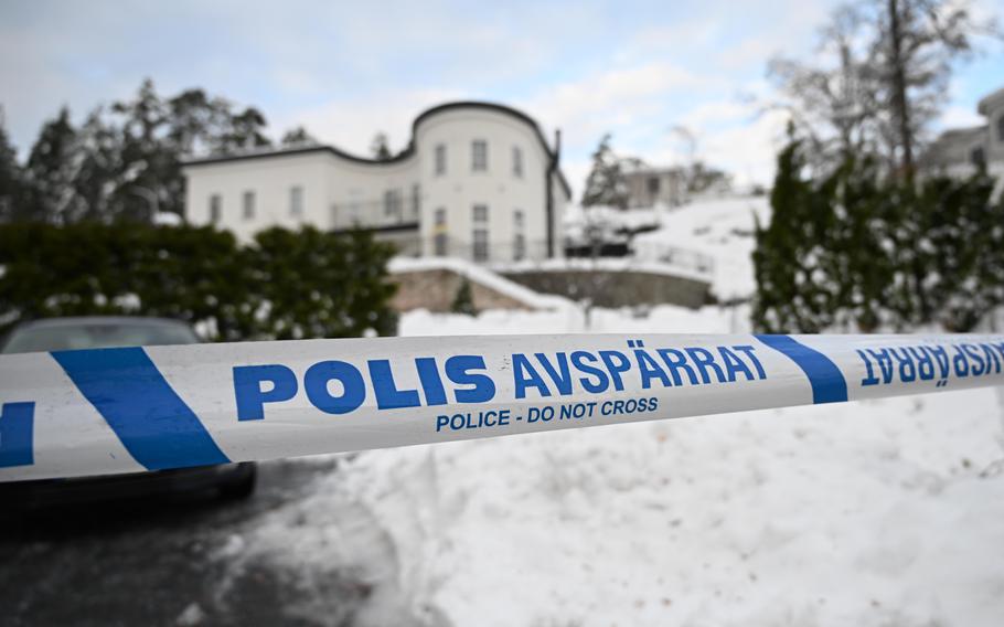 A police tape cordons an area outside a house where Swedish Security Service allegedly arrested two people on suspicions of espionage in a predawn operation in Stockholm, Tuesday, Nov. 22 2022. 