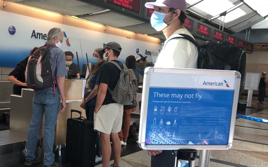 Passengers check in for flights at Denver International Airport on June 5, 2021. Germany tightened coronavirus restrictions in mid-August for travelers from the United States, where the delta variant has pushed new infections back up to nearly 129,000 a day.