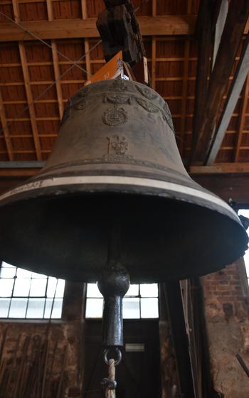 One of the many bells on display at the Museum of Bell Foundry Mabilon in Saarburg, Germany. Most bells carry an inscription, usually the name of the person who paid for the bell, and are often decorated with angels or saints and sometimes a motto or blessing.