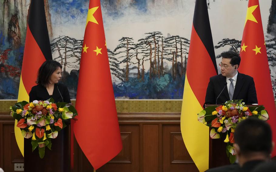 German Foreign Minister Annalena Baerbock, left, and Chinese Foreign Minister Qin Gang attend a briefing in Beijing on Friday, April 14, 2023. 