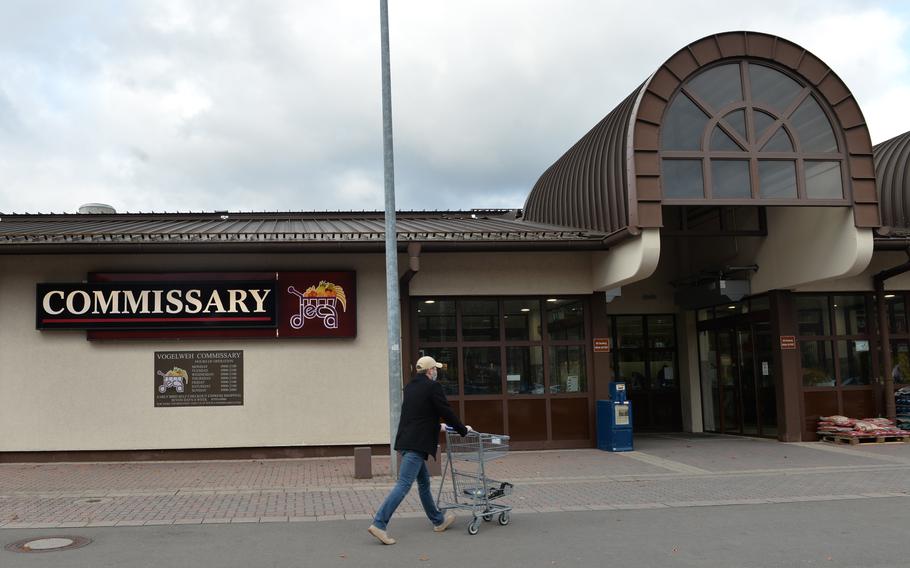 A shopper walks toward the Vogelweh Commissary in Kaiserslautern, Germany,  on Nov. 22, 2021. Some commissaries in Europe are having difficulty in restocking certain items as a result of shipping delays and truck driver shortages. 