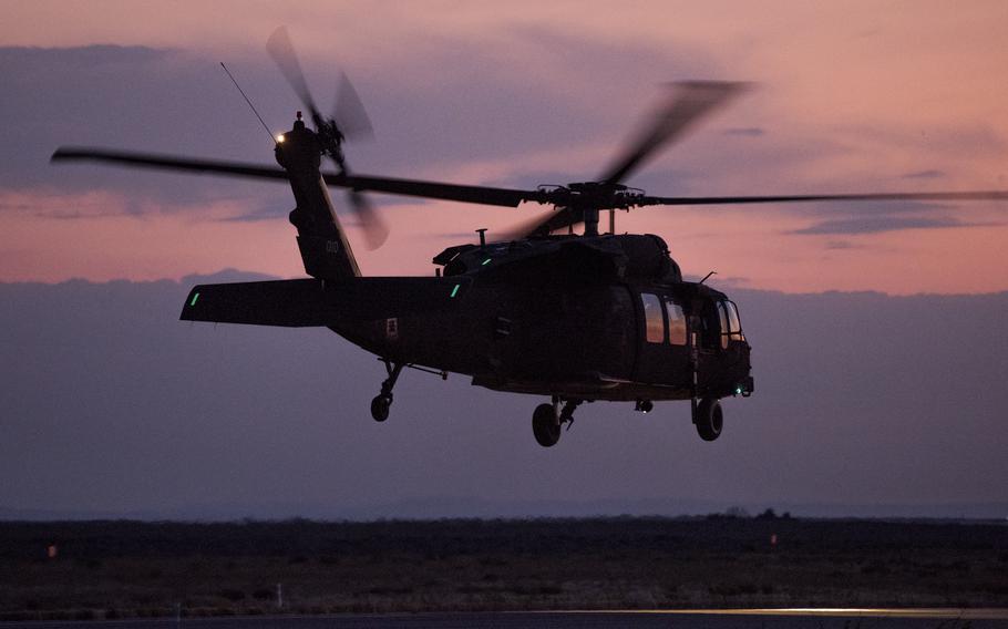 An Army National Guard UH-60 Black Hawk helicopter flies near Gowen Field in Boise, Idaho. 