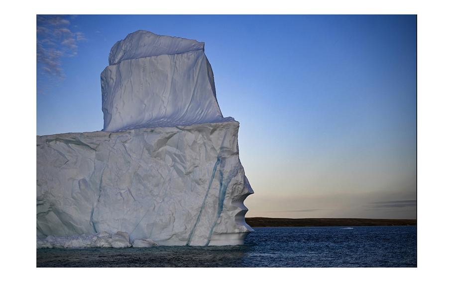 A melting iceberg drifts due to high temperatures in Scoresby Fjord near Ittoqqortoormiit, Greenland, on Aug. 12, 2023. 