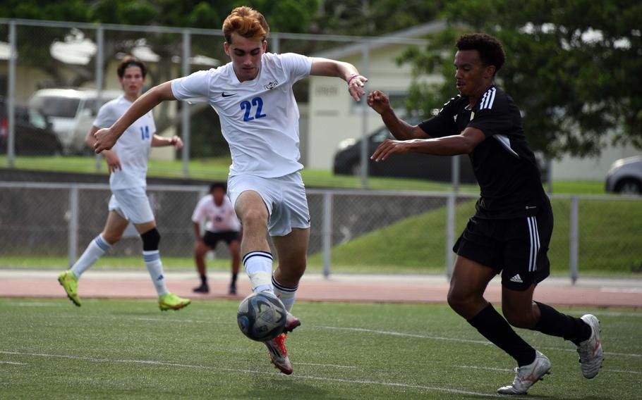 CAJ's William Arjmandpour plays the ball against Kadena's Elijah Whipp.