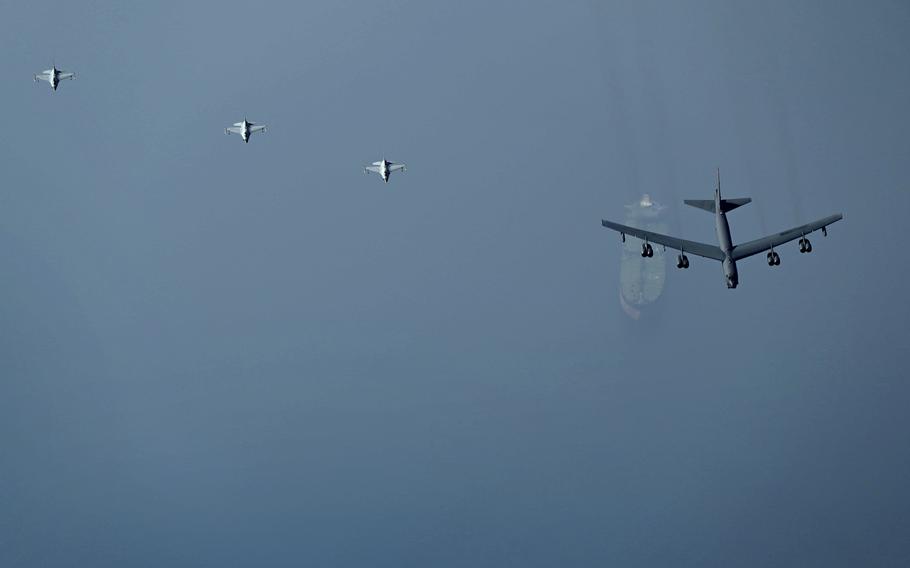 This photo released by the U.S. Air Force shows a B-52H Stratofortress assigned to the 5th Bomb Wing, Minot Air Force Base, North Dakota, flying over an oil tanker in the Middle East on Sunday, Sept. 4, 2022. 