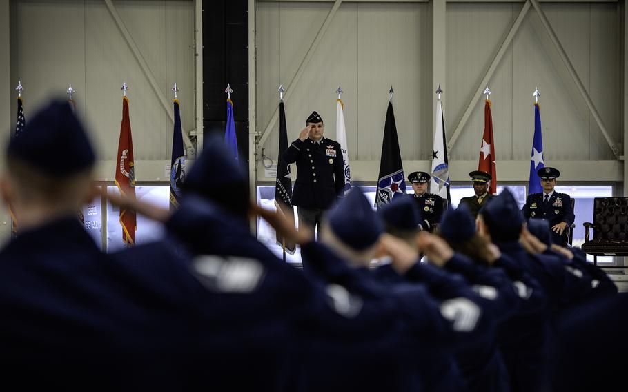 Col. Max Lantz, newly appointed commander of the U.S. Space Forces Europe and Africa, returns the first salute of the guardians at Ramstein Air Base, Germany, on Dec. 8, 2023.