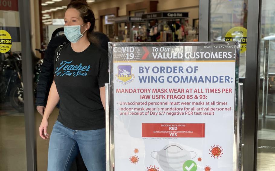 An exchange customer wears a mask while leaving a store at Camp Humphreys, South Korea, Jan. 27, 2022.