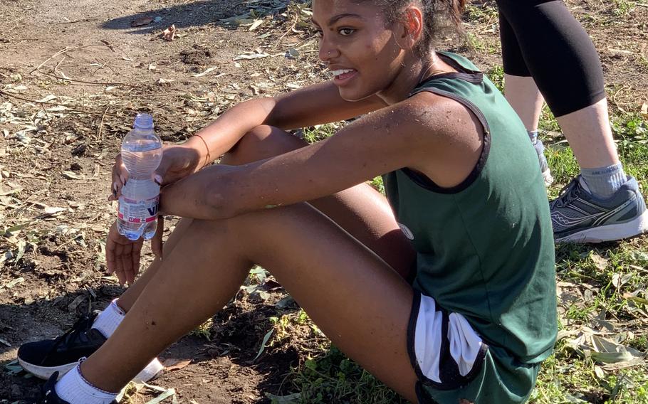 Naples’ Abigail Michienzi takes a rest after taking first place with a time of 21 minutes, 31 seconds in the last girls cross country race of the season on Saturday, Oct. 16, 2021.   