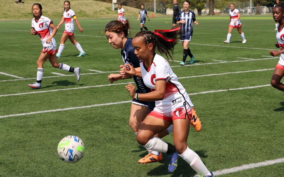 E.J. King’s Miu Best dribbles upfield against Sacred Heart during Monday’s girls Division II soccer matches. The Symbas and Cobras tied 1-1.