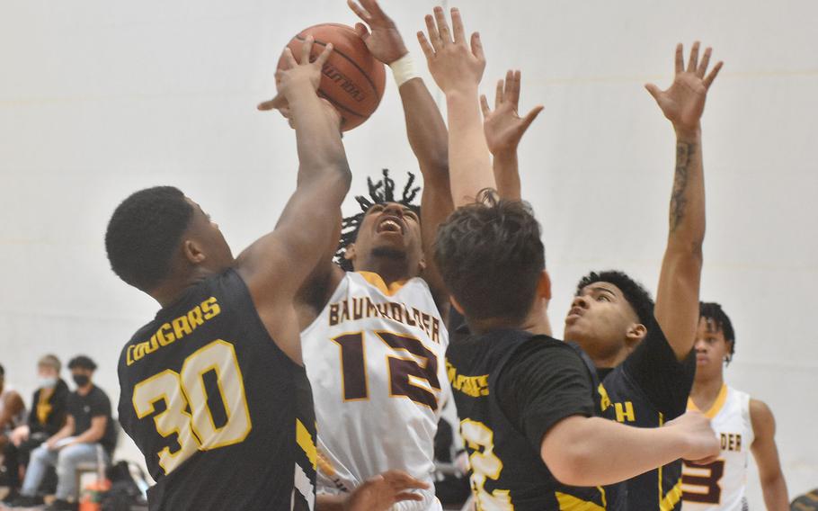 Just about everyone on Ansbach seems to have a hand up to try to prevent Baumholder's Jovan Velasquez from scoring on Thursday, Feb. 24, 2022 at the DODEA-Europe Division III championships. It worked on this play, but not during the game as the Bucs stayed unbeaten in tourney play.