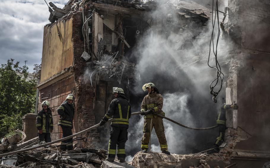 Firefighters work at a heavily damaged residential building on Sept. 8, 2022, in the eastern city of Sloviansk, Ukraine.