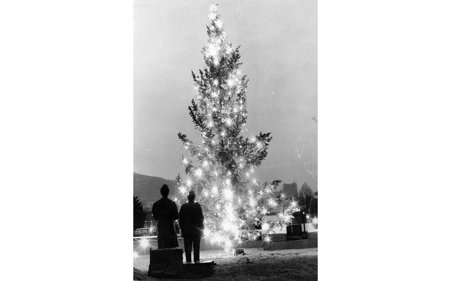 Christmas lights glow on a 35-foot tree at Yongsan Main Post in South Korea after they were turned on by Lt. Col. Donal Miller, commander, U.S. Army Garrison, Dec. 20, 1970. 