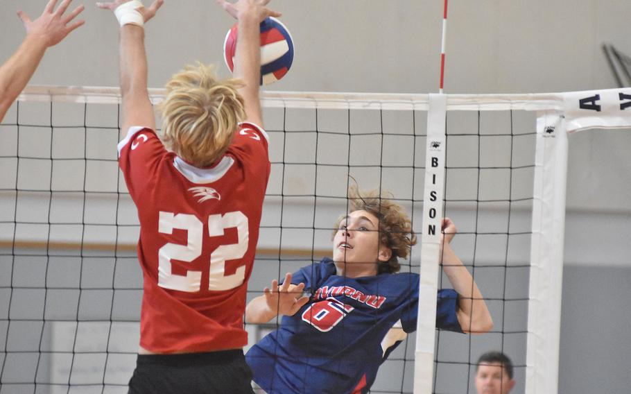 Aviano's Ethan Okkerse watches American Overseas School of Rome's Parker Huber block his shot Saturday, Oct. 15, 2022. The ball landed outside the court, though, and the Saints won the point and the match.