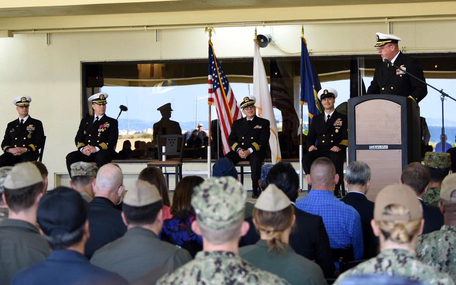 Capt. Patrick Dziekan, the new leader of Fleet Activities Okinawa, speaks during his change-of-command ceremony at White Beach Naval Facility, Thursday, Dec. 16, 2021.