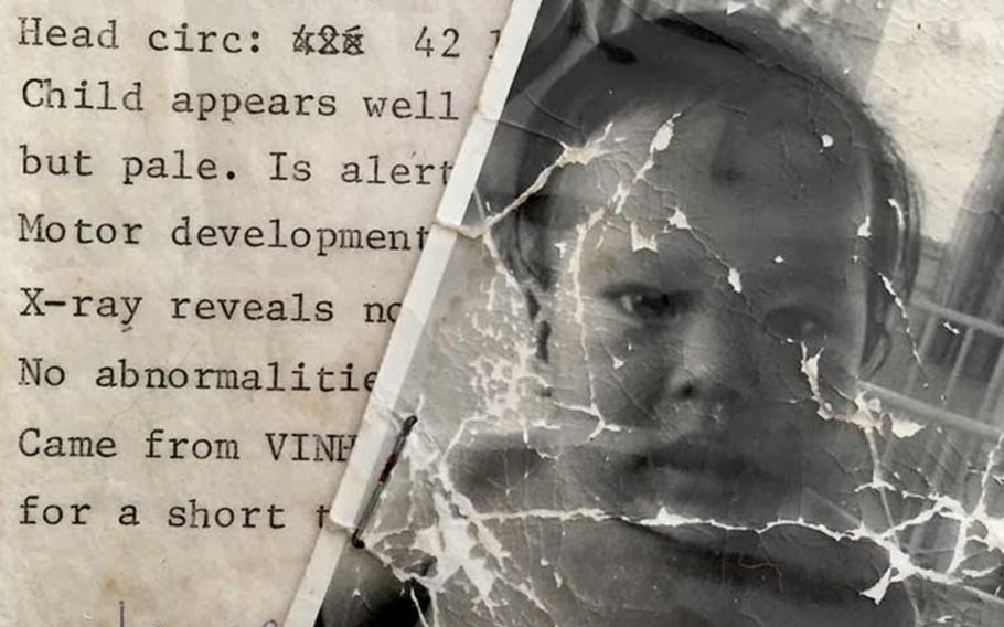 A black and white photograph of a baby overlaps with a document describing the name and health of the baby.