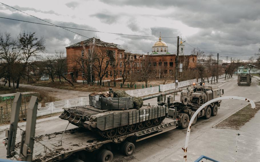 A Ukrainian tank is transported in Izium, Ukraine, in December. 