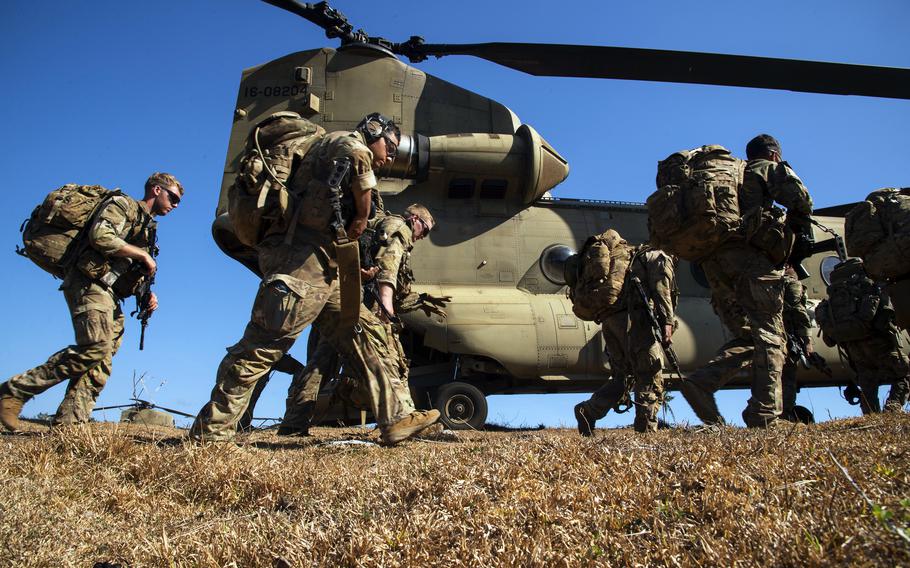 Soldiers with the 25th Infantry Division walk toward a CH-47F Chinook helicopter during a Balikatan air-assault drill on Batan Island, Philippines, May 5, 2024. 