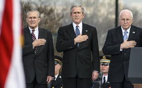 Secretary of Defense Donald Rumsfeld, President George W. Bush and Vice President Dick Cheney stand for the playing of the national anthem during Rumsfeld's retirement ceremony at the Pentagon in 2006.