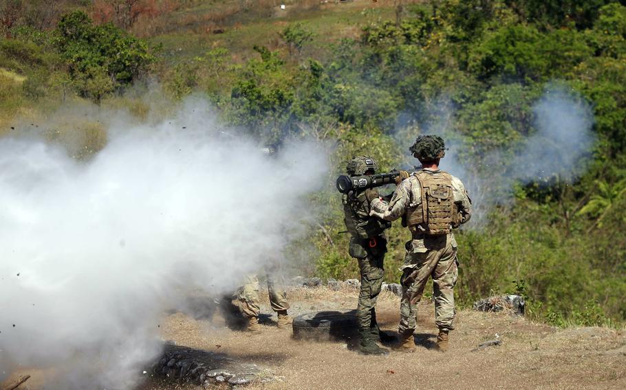 U.S. and Filipino soldiers fire AT-4 anti-tank weapons during the annual Salaknib exercise at Fort Magsaysay, Philippines, Friday, March 31, 2023.