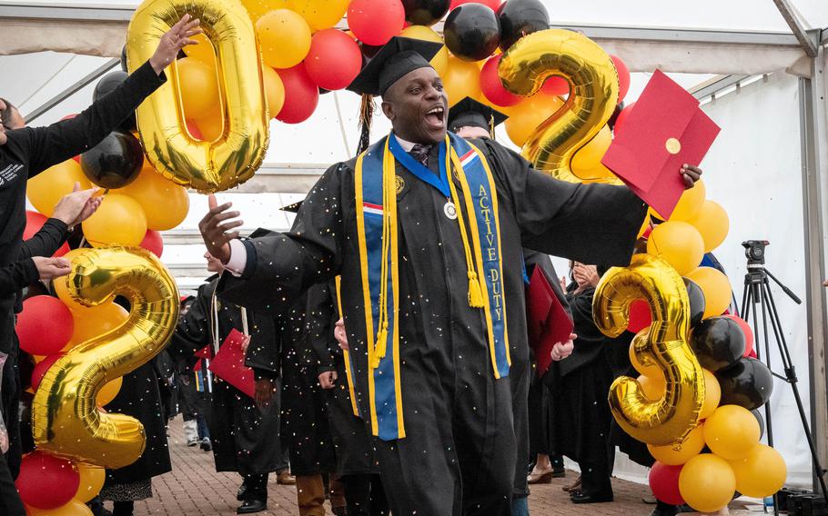 Army Sgt. Christian Awuku celebates after graduating with a bachelor’s degree from the University of Maryland Global Campus, Saturday, April 29, 2023.