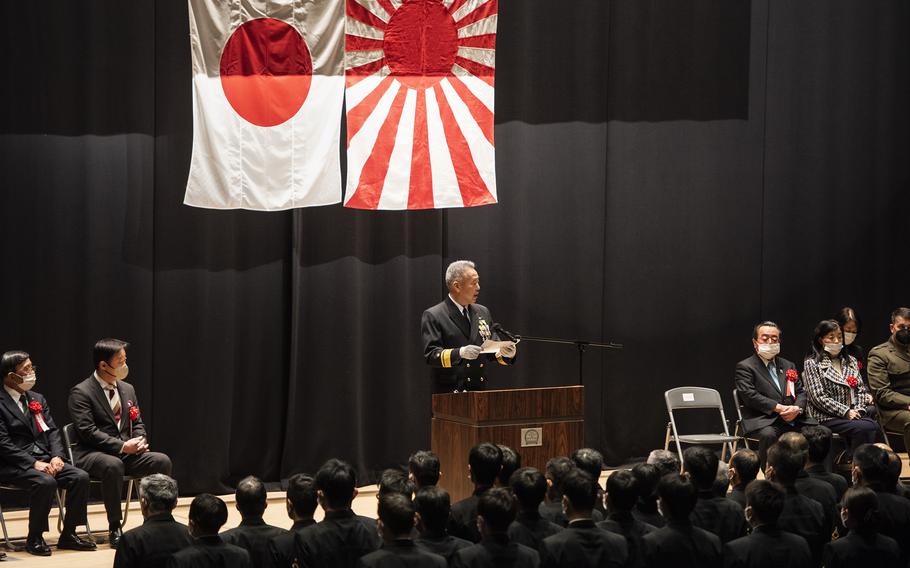 Japan Maritime Self-Defense Force Adm. Takuhiro Hiragi speaks during Fleet Air Wing 31's 50th anniversary ceremony at Marine Corps Air Station Iwakuni, Japan, March 4, 2023.