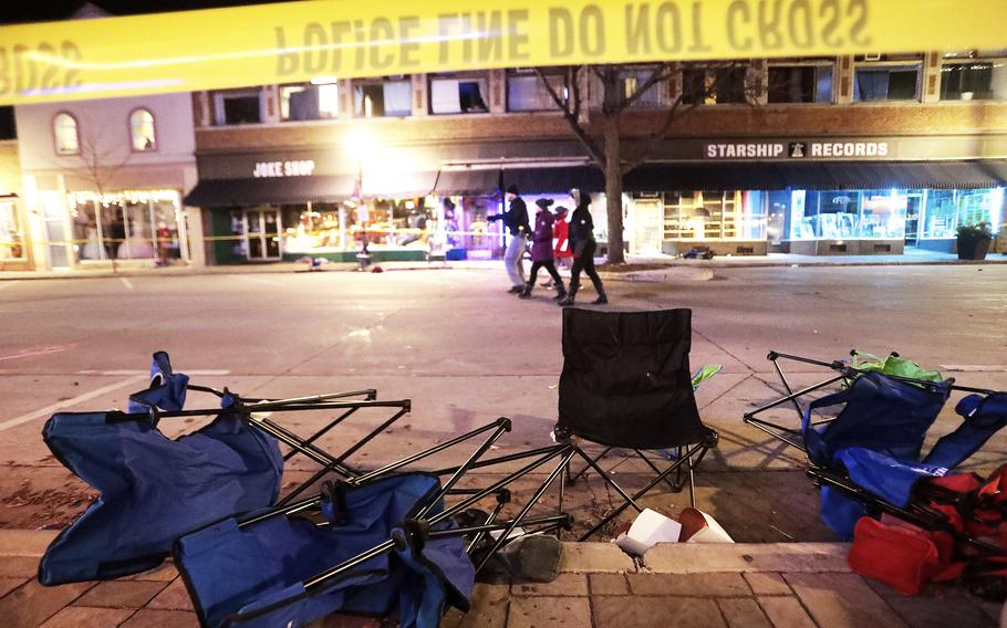 Toppled chairs line W. Main St. in downtown Waukesha, Wis., after an SUV drove into a parade of Christmas marchers Sunday, Nov. 21, 2021.