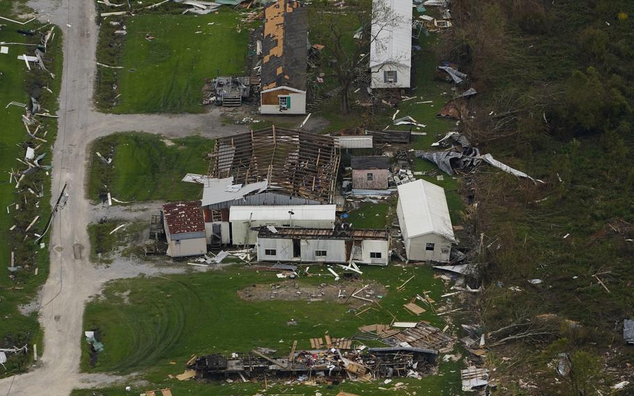 In this aerial photo, the remains of destroyed homes are seen in the aftermath of Hurricane Ida, Sept. 6, 2021, in Lafitte, La. Damage wrought by Hurricane Ida in the U.S. state of Louisiana and the flash floods that hit Europe last summer have helped make 2021 one of the most expensive years for natural disasters. Reinsurance company Munich Re said Monday, Jan. 10, 2022 that overall economic losses from natural disasters worldwide last year reached $280 billion.
