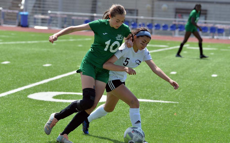 Naples ‘ Emerson Shorey and Vicenza’s Dari Lopez-Nieves fight for the ball in the Division II girls final at the DODEA-Europe championships at Ramstein, Germany, May 18, 2023. The Wildcats beat the Cougars 3-1 to take the title.