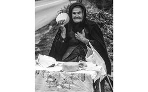 Gus Schuettle/Stars and Stripes
Yugoslavia, September, 1989:  A woman at a roadside table tries to convince passers-by to buy some cheese.