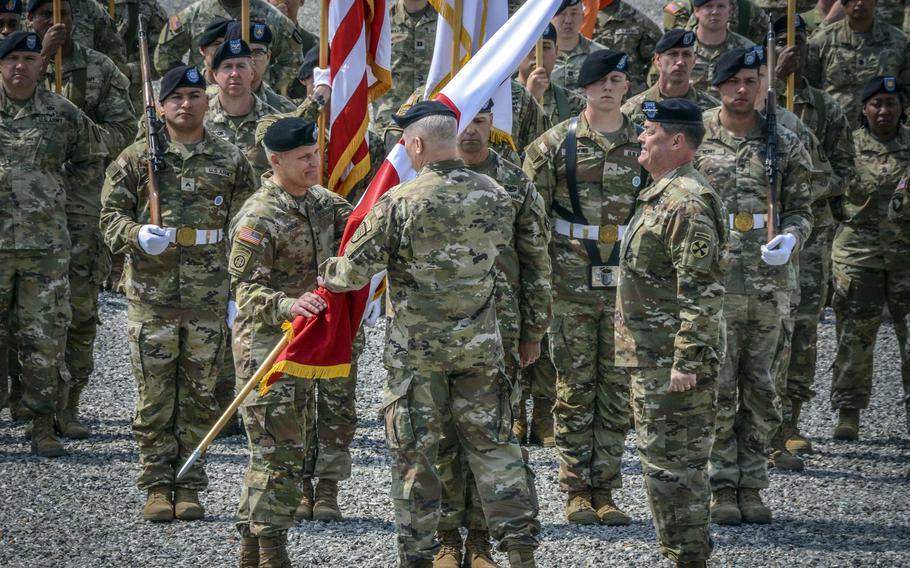 Lt. Gen. Christopher LaNeve receives the Eighth Army colors during a change-of-command ceremony at Camp Humphreys, South Korea, Friday, April 5, 2024. 