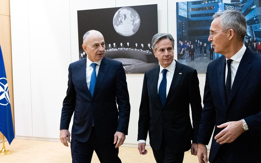 U.S. Secretary of State Antony Blinken, center, walks with NATO Secretary-General Jens Stoltenberg, right, and Deputy Secretary-General Mircea Geoana at alliance headquarters in Brussels on Nov. 28, 2023. Blinken is in Belgium for two days of meetings with NATO foreign ministers.