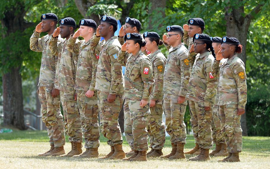 21st Theater Sustainment Command soldiers salute during the national anthems of the U.S. and Germany at a change of command ceremony at Daenner Kaserne in Kaiserslautern, Germany, on Wednesday, June 7, 2023.